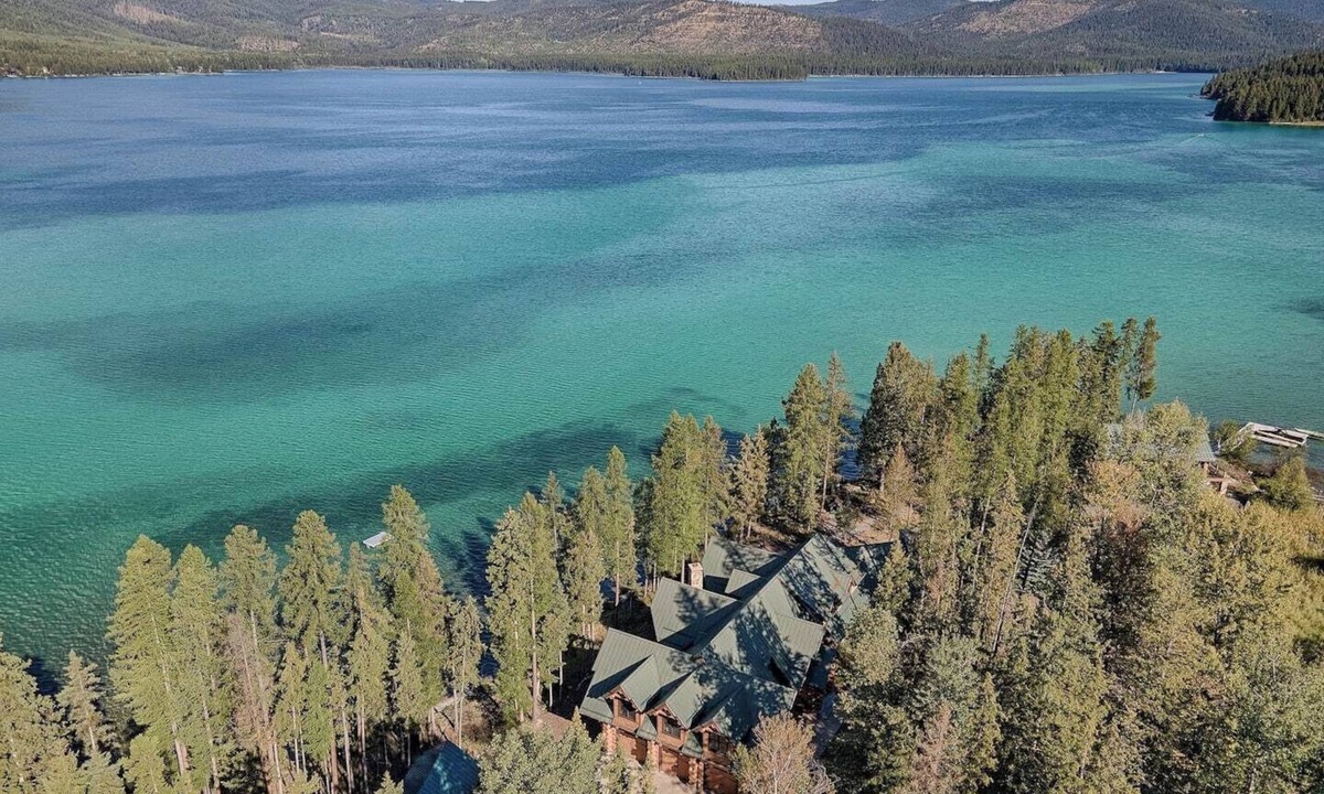 Marion House | A stunning Montana log retreat on 50 secluded acres on Ashley Lake-perfect for large groups, featuring rustic luxury, expansive spaces, and room for up to 14 guests.