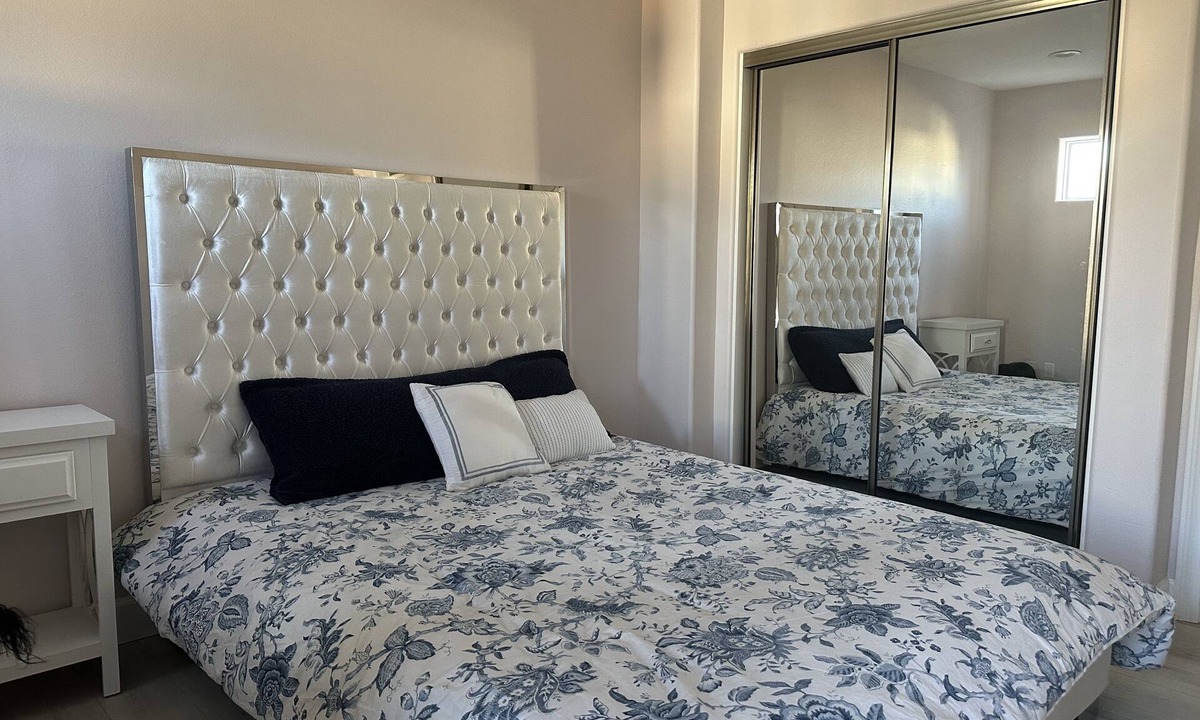 Sylmar House | Bedroom and bathroom in a quiet townhouse.