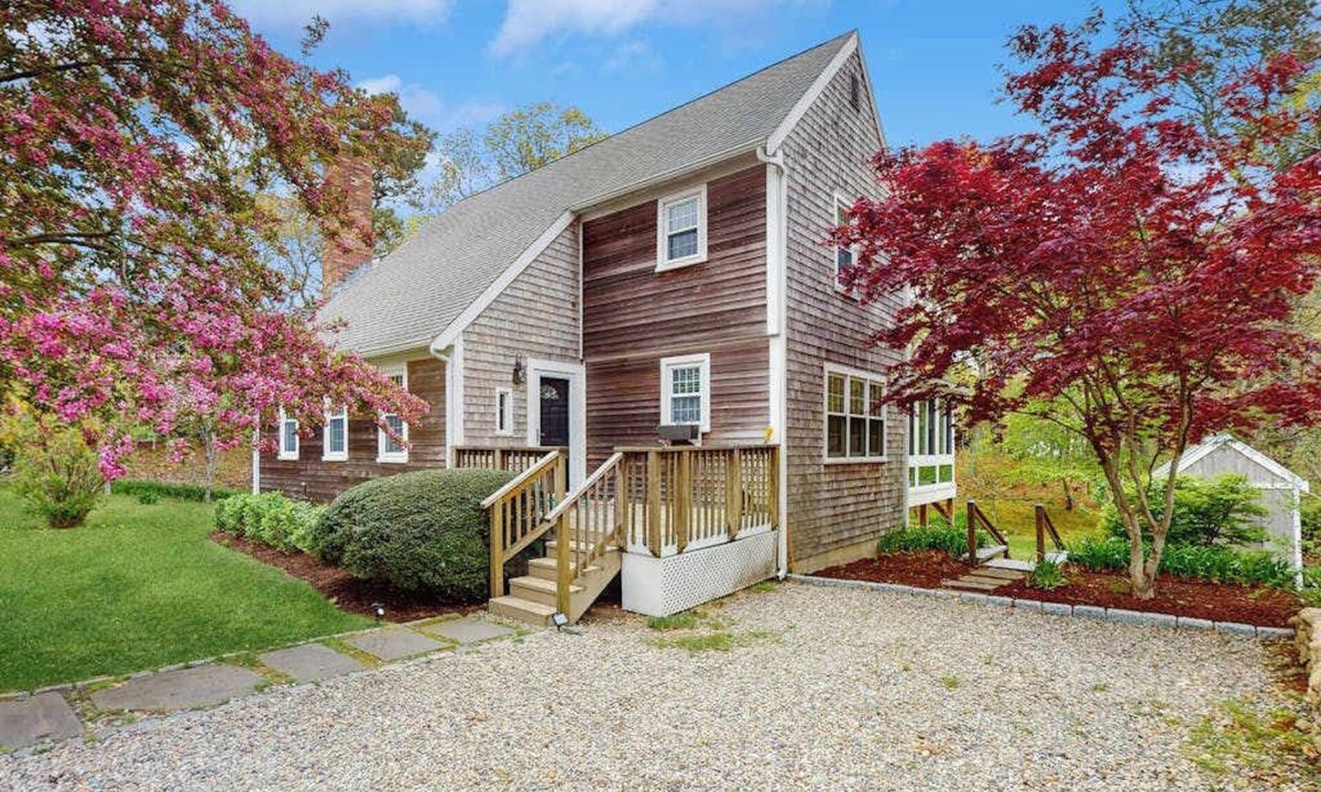 Brewster House | Cheery house with deck, sunroom & patio - short walk to pond, beach & Rail Trail