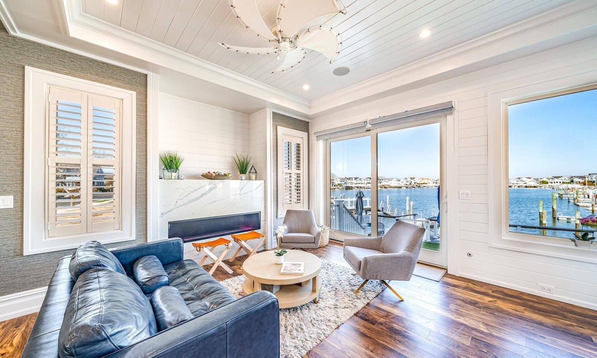 Stone Harbor House | Discover an extraordinary waterfront haven with this magnificent bayfront residence that boasts a.
