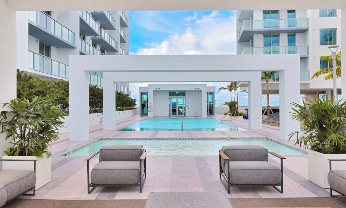 Northeast Miami Apartment | Enjoy a panoramic view of the pool and Miami’s stunning sunsets This.