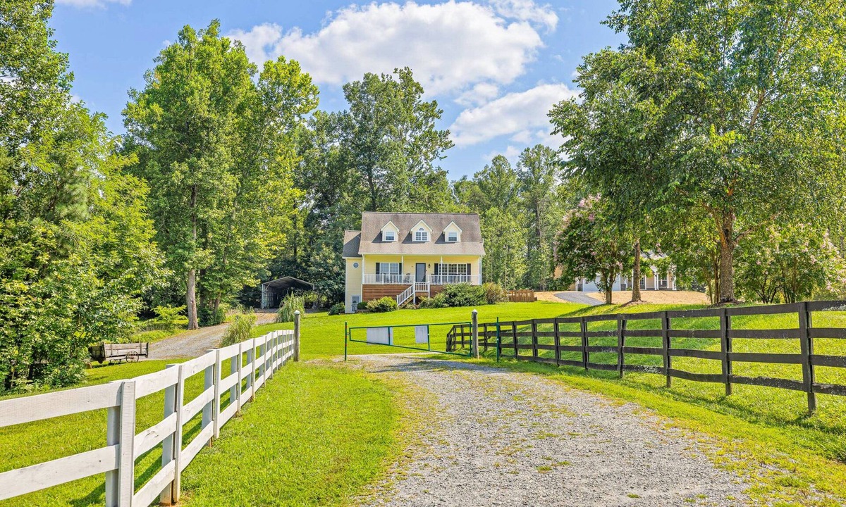 Louisa House | Lakeview escape near beach with fenced dog run, porch & dock with one boat slip