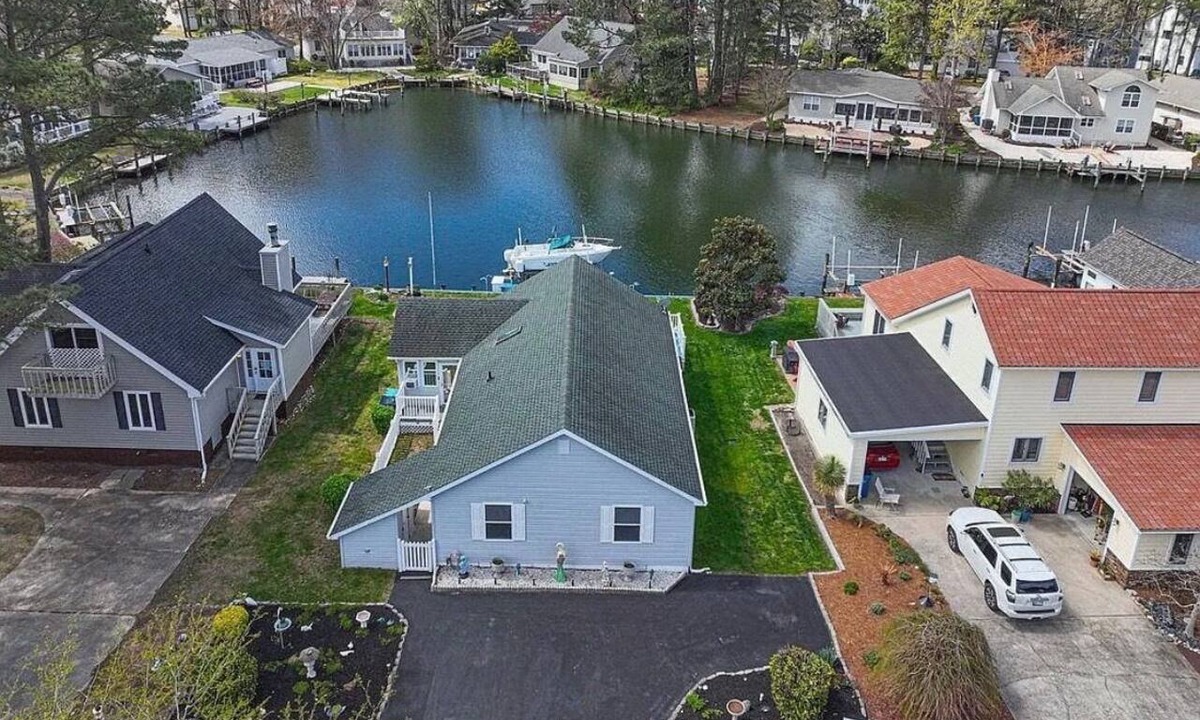 Ocean Pines House | Spacious canal-front home with private dock, parking, and family-friendly amenities.