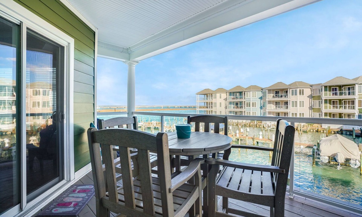Chincoteague House | Sunset Bay Villa 206 | Luxury Condo w/Waterside Balcony, Gourmet Kitchen + Pool & Fitness