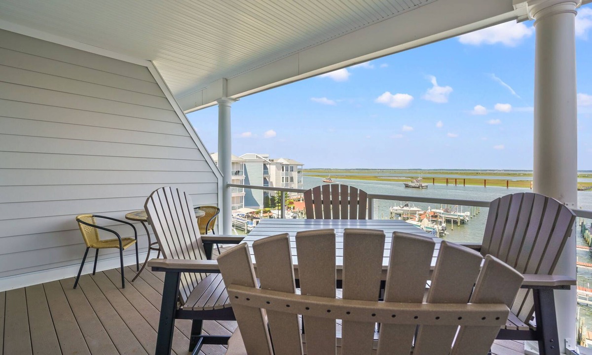 Chincoteague House | Sunset Bay Villa 312 | Waterfront Balcony + 14' Boat Slip + Pool Access