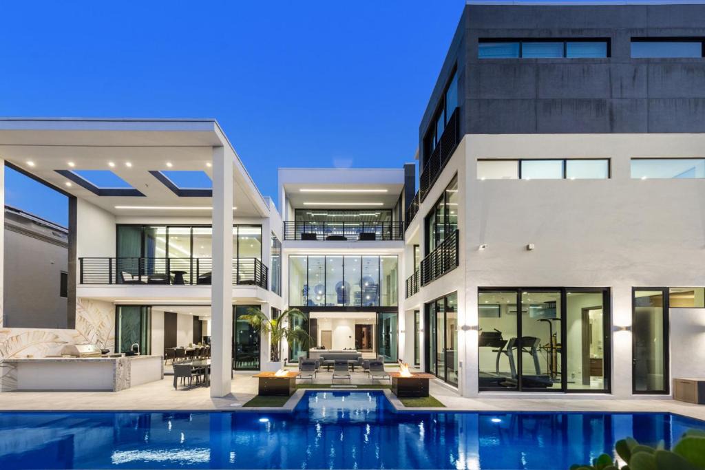 Coral Ridge House | Three Story Waterfront Villa with Basketball and Mini Golf