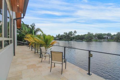 Miami Lakes House | Vista Azul Lake Front Home with Hot Tub and Swim Spa, Fishing Dock, Gym, Game Room with Darts, Ping Pong, A Pool Table and more!