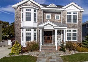 Located just 1 ½ blocks to the beach, this distinctive property boasts seven (7) bedrooms, each with their own custom, private bath, as well as one powder room and an exquisite, solid mahogany, outdoor shower