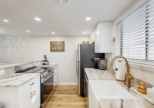 Updated coastal getaway with pool - walk to beach, dining, shops & entertainment