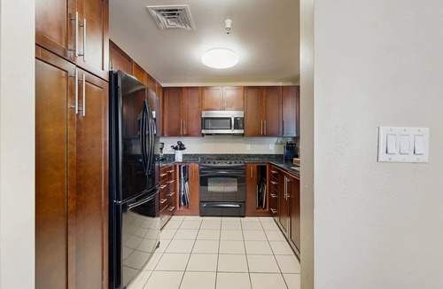 Sandbridge Condo | 2nd-floor bay- & ocean-view condo with balcony, outdoor pool, grills & gym
