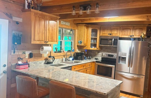 Seven Devils Cabin | 3BR 3BA Log Cabin, Pond Front, Hot Tub, Pool Table, near Skiing & Pet friendly