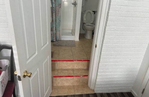 Tranquil Harbour Resort | 40th St En Suite/ Enter the door between Outside Shower and Air Conditioner.