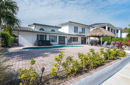 Lighthouse Point House | 4BR Tiki Villa, Pool, Spa, Dock & Private Waterfront