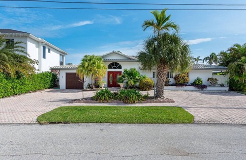 Lighthouse Point House | 4BR Tiki Villa, Pool, Spa, Dock & Private Waterfront