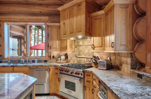 Marion House | A stunning Montana log retreat on 50 secluded acres on Ashley Lake-perfect for large groups, featuring rustic luxury, expansive spaces, and room for up to 14 guests.