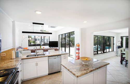 Lighthouse Point House | A Tropical paradise backyard pool, family friendly, Boat lift and Dock
