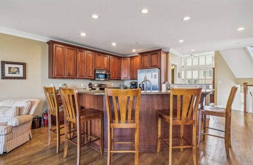 Fenwick Island House | Activities included up to $300 FREE PER WEEK! NEW LISTING 2024! Exceptional and spacious multi-level 4 bedroom plus den, 4 full bath townhome overlooking the bay offering panoramic views and glorious sunsets from any of the 3 open decks!