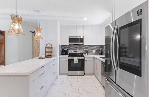 Oakland Park House | Backyard Paradise: Gazebo, Outdoor TV, Grill, Sandpit – Perfect Getaway