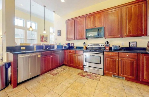 The Commons House | Bayside Resort home with decks, gas fireplace, bikes, ping-pong table, W/D, & AC