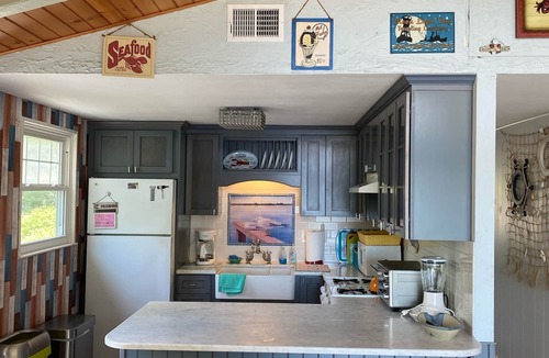 East Falmouth House | Beach front! fenced yard, dogs welcome, central air, fire pit, 3 kayaks, hot tub