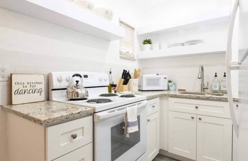Santa Barbara Estates Condo | Beautiful Waterfront Condo on Canal with Pool & Walk to Beach! Boat Watch! 1b/1b