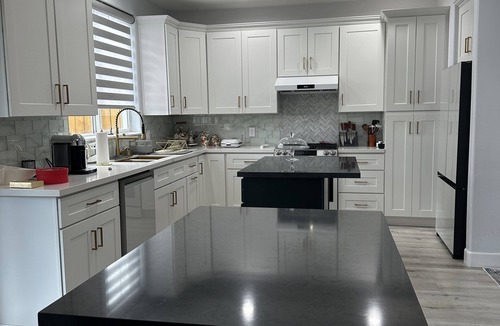 Sylmar House | Bedroom and bathroom in a quiet townhouse.