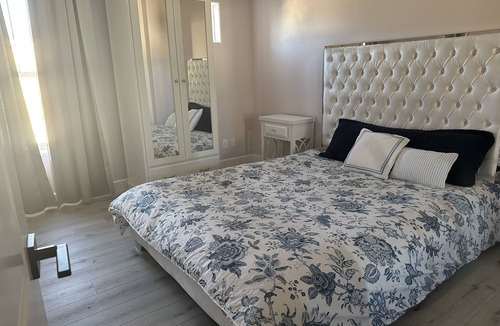 Sylmar House | Bedroom and bathroom in a quiet townhouse.