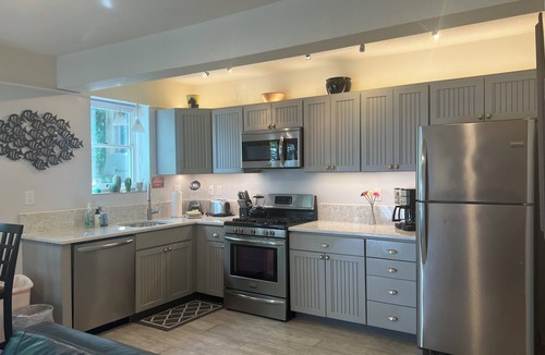 Commercial Street Condo | Best Patio on Commercial-Tropical Garden-Prime Location
