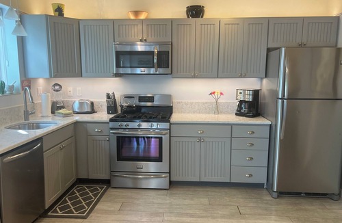 Commercial Street Condo | Best Patio on Commercial-Tropical Garden-Prime Location