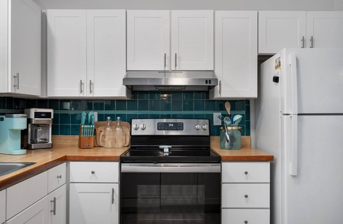 Colington Harbour House | Boho-chic Banks getaway with luxe interior, hot tub, AC, & W/D - dog friendly