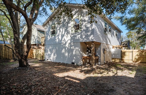 Colington Harbour House | Boho-chic Banks getaway with luxe interior, hot tub, AC, & W/D - dog friendly