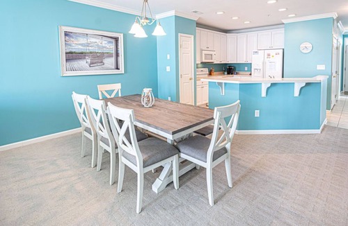 Sunset Island Condo | Bright, modern 3-bedroom luxury condo in gated community, free WiFi, private bayside beaches, an indoor and outdoor pool, and more located midtown and a couple blocks to the ocean!