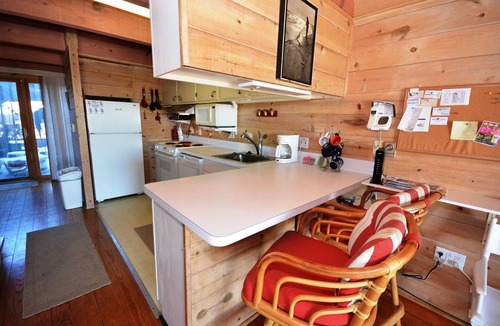 Midtown Ocean City House | Cabin-like 2 Bedroom Oceanfront Townhouse with Free WiFi and Personal Stretch of Sand is Perfect for Kids and Located in Midtown with Beach a Few Steps Away!