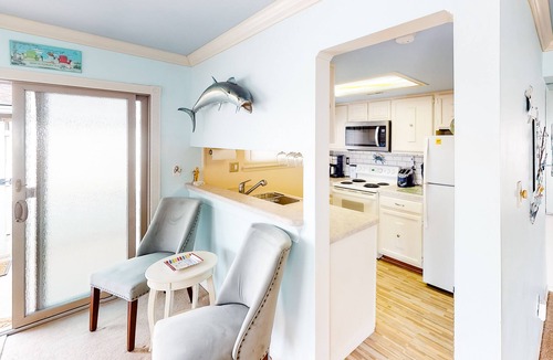 North Ocean City Condo | Canal-Front Retreat w/Pool - Walk to Beach & Restaurants