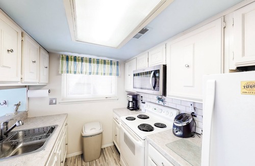 North Ocean City Condo | Canal-Front Retreat w/Pool - Walk to Beach & Restaurants