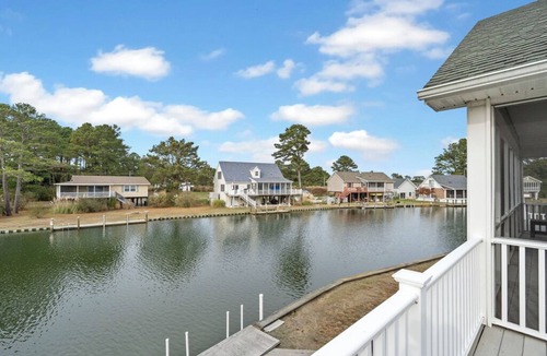 Deep Hole House | Canalfront home with Screened Porch by Seaside Vacations & Sales