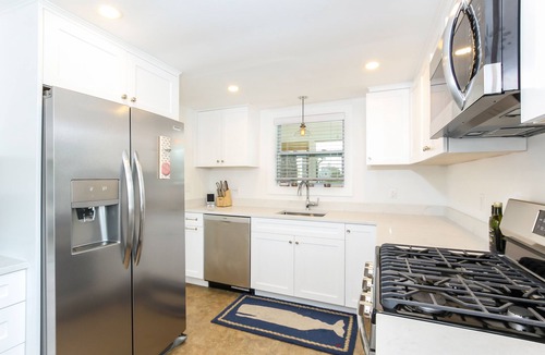 Centerville Cottage | CENTERVILLE RIVER WATERFRONT! DOCK AND DIRECT LONG BEACH ACCESS! Pet Friendly.