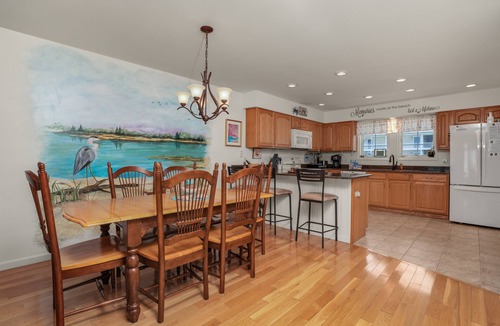 Chincoteague House | Charlie's Bayside Retreat | South Main Waterfront w/Private Boat Slip, Screened Porch & Pets