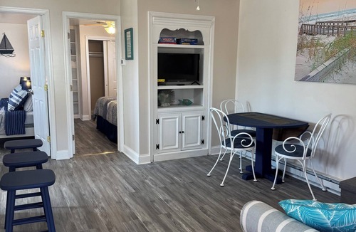 Long Neck Apartment | Charming two-bedroom, one bath, with screened porch is your perfect getaway.