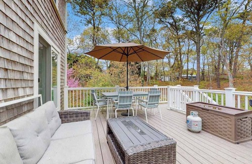 Brewster House | Cheery house with deck, sunroom & patio - short walk to pond, beach & Rail Trail