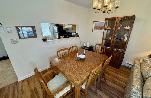 Brewster Condo | Classic Cape Cod townhouse in Brewster with patio, near Rail Trail and bay beaches.