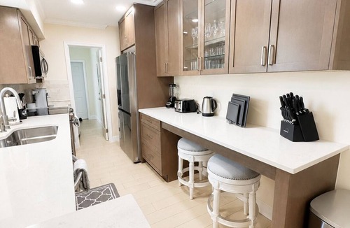 Tropic Palms House | Coastal retreat with heated saltwater pool & spa in prime Delray Beach.