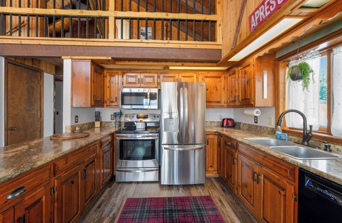 Whitefish House | Cozy Cabin w hot tub & wood-burning fireplace