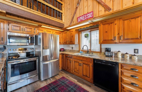 Whitefish House | Cozy Cabin w hot tub & wood-burning fireplace