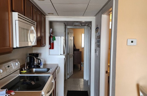 Wildwood Condo | Cozy condo with a Pool, AC, and WiFi. One block from boardwalk and beach!