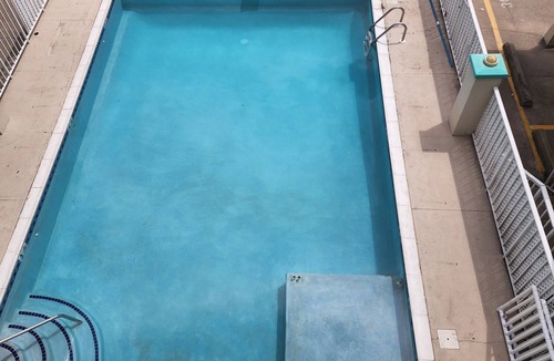 Wildwood Condo | Cozy condo with a Pool, AC, and WiFi. One block from boardwalk and beach!