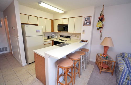 North Ocean City Condo | Cozy, inviting 1 bedroom condo with an outdoor pool and gorgeous canal-front view located uptown on the bayside just a few blocks from the beach!