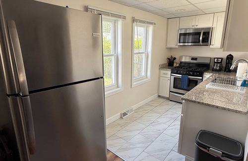 Warwick House | Cozy Oakland Beach bungalow for 2! One block from the water and a short walk to beaches, restaurants, and shops. Includes a living room, kitchen, bedroom, and full bath.