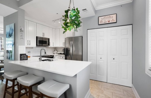 East Ocean Ave House | Cozy orange beachside townhouse with yard, Wi-Fi, & full kitchen in Lantana!