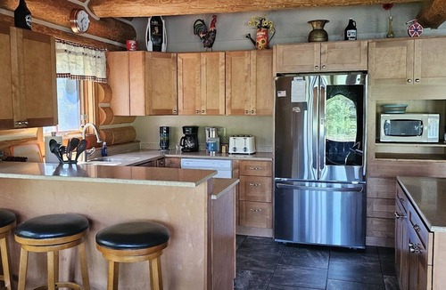 Columbia Falls Ski Chalet | Custom Log Home bordering Glacier Park and North Fork River!